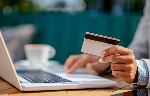 Person with credit card in hand