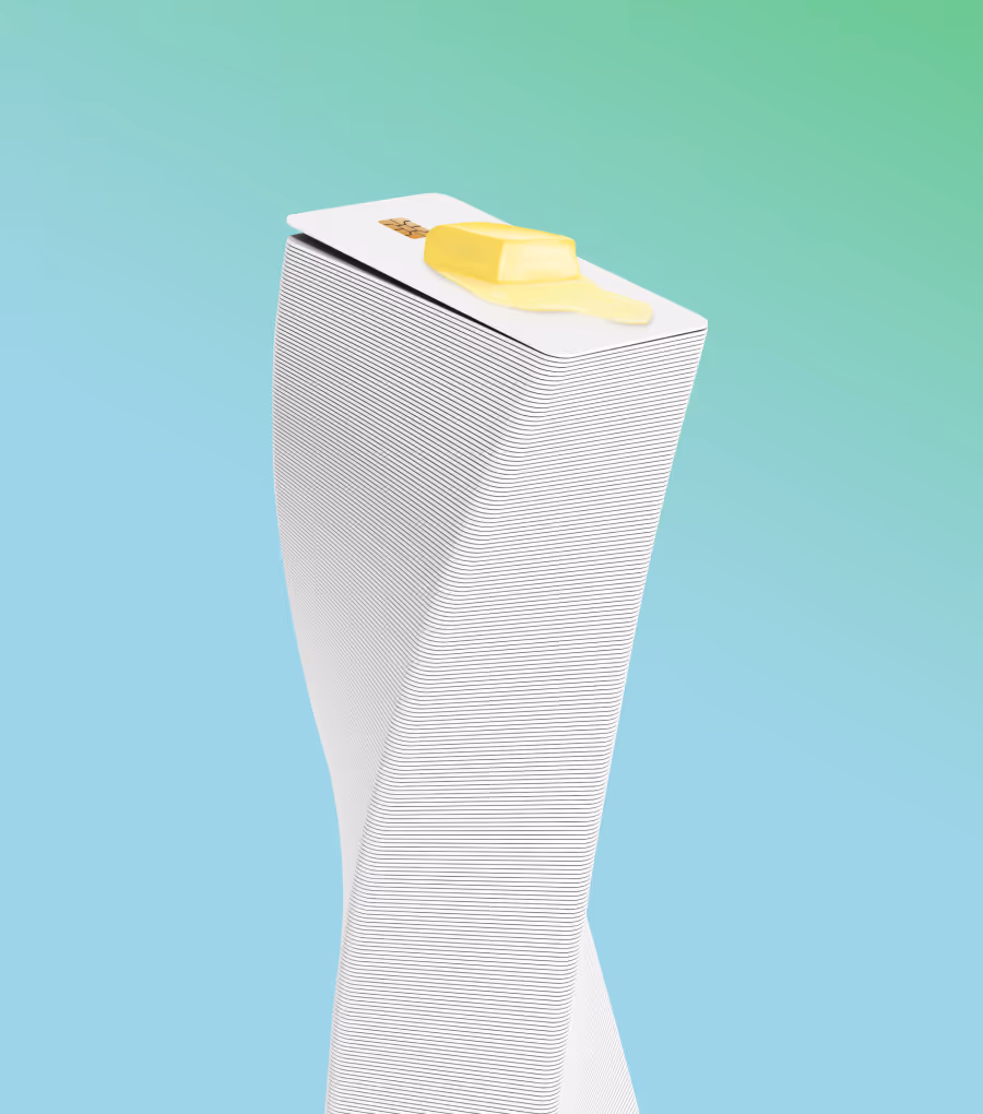 Stack of credit cards with a pat of melting butter on top