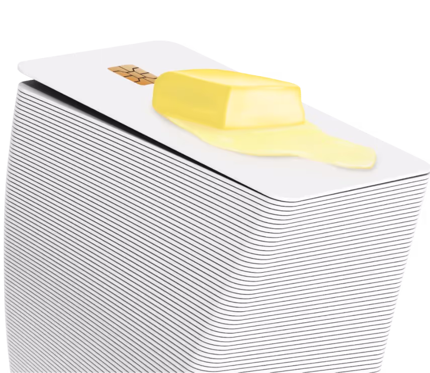 Stack of credit cards with a pat of melting butter on top