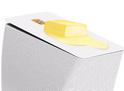 Stack of credit cards with a pat of melting butter on top